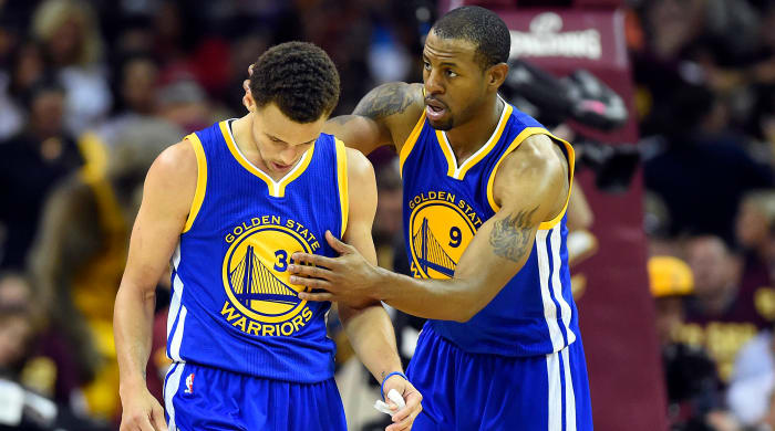 Warriors wing Andre Iguodala consoles Stephen Curry during the 2015 NBA Finals.